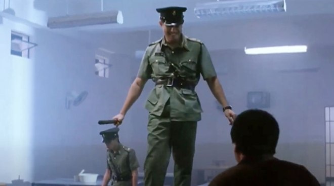 Elvis Tsui plays the sadistic warden Zau in "Prison On Fire II" (1991)